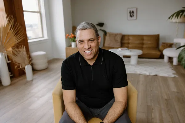 mike parry wearing a black shirt and smiling
